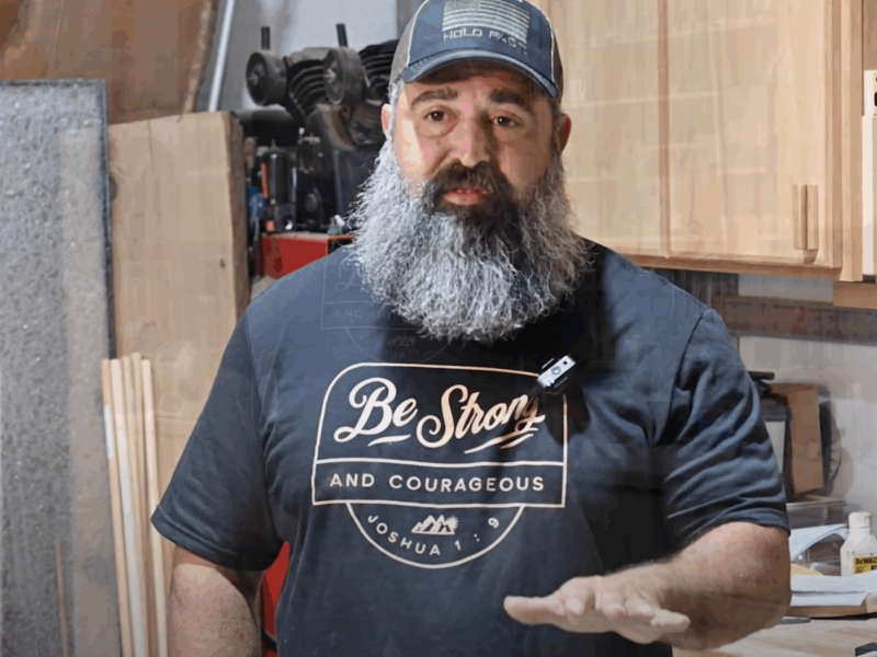 PEP graduate sharing testimonial inside a workshop while wearing a "Be Strong and Courageous" shirt