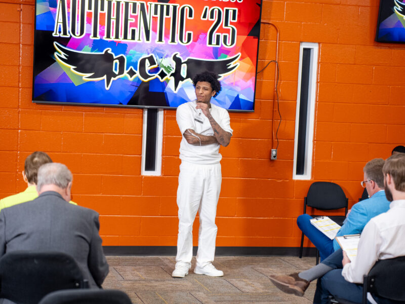 Prison Entrepreneurship Program participant presents a business idea during a business plan competition