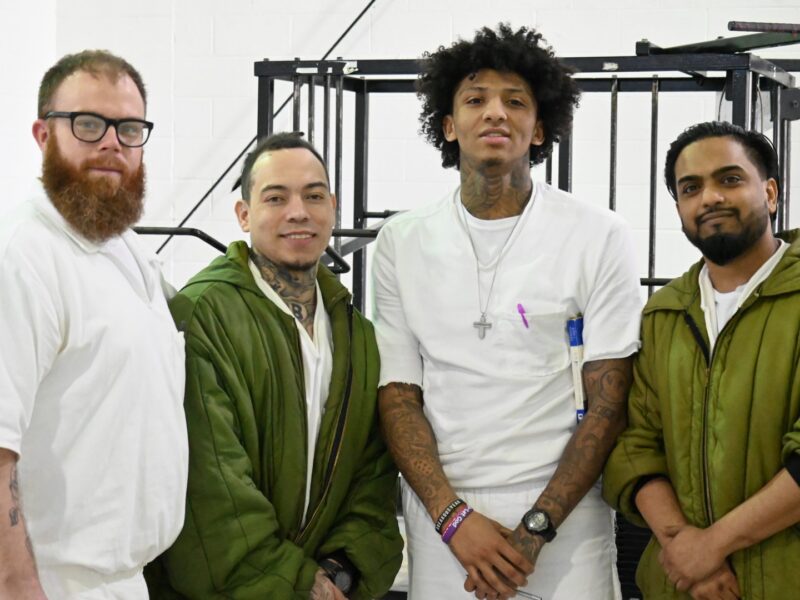 Prison Entrepreneurship Program participants pose together during a PEP class session focused on personal development and second chances