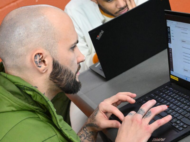 Prison Entrepreneurship Program participant works on a digital business training module during a PEP computer lab session in a Texas prison