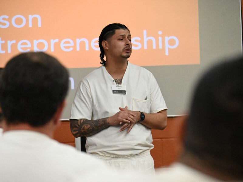 Prison Entrepreneurship Program participant presents a business pitch to classmates during a PEP workshop inside a Texas correctional facility