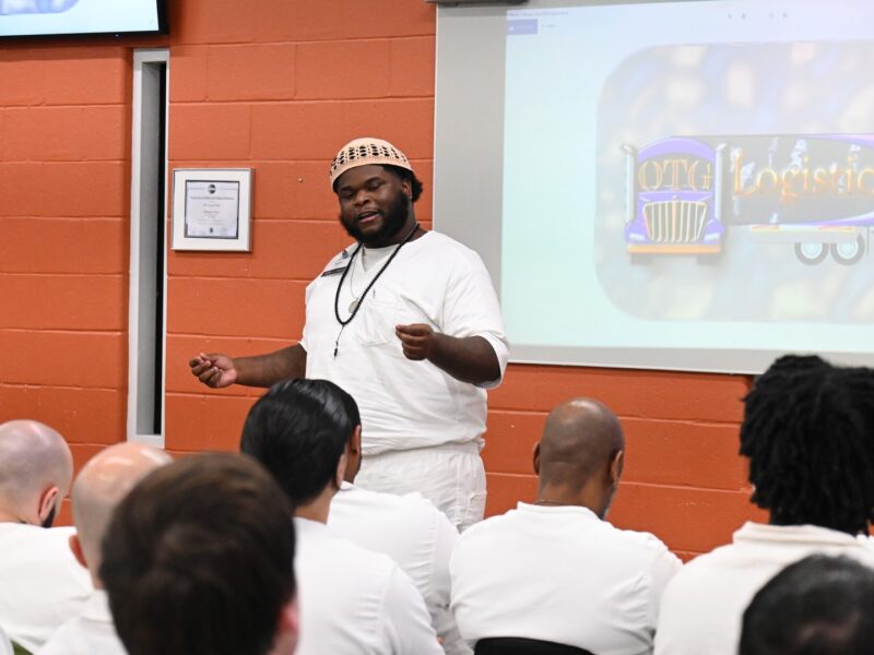 Prison Entrepreneurship Program participant pitches a logistics business idea during a PEP class presentation inside a Texas prison unit