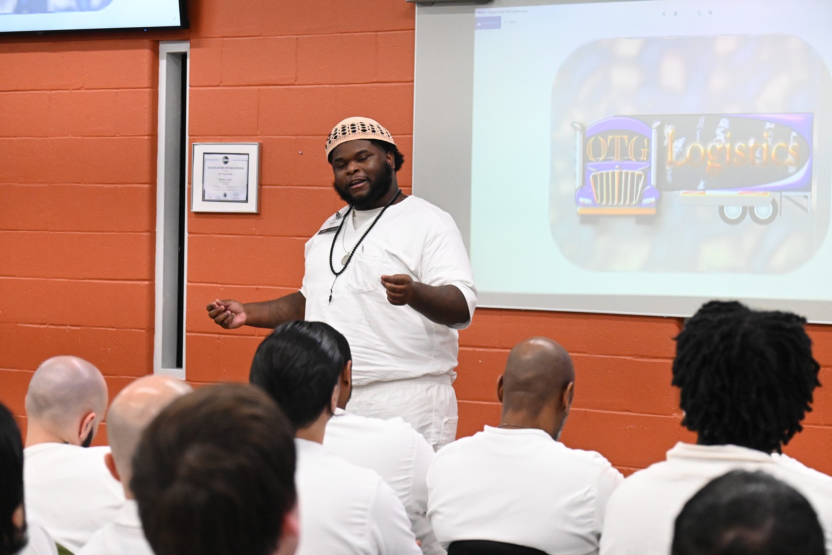 Prison Entrepreneurship Program participant pitches a logistics business idea during a PEP class presentation inside a Texas prison unit
