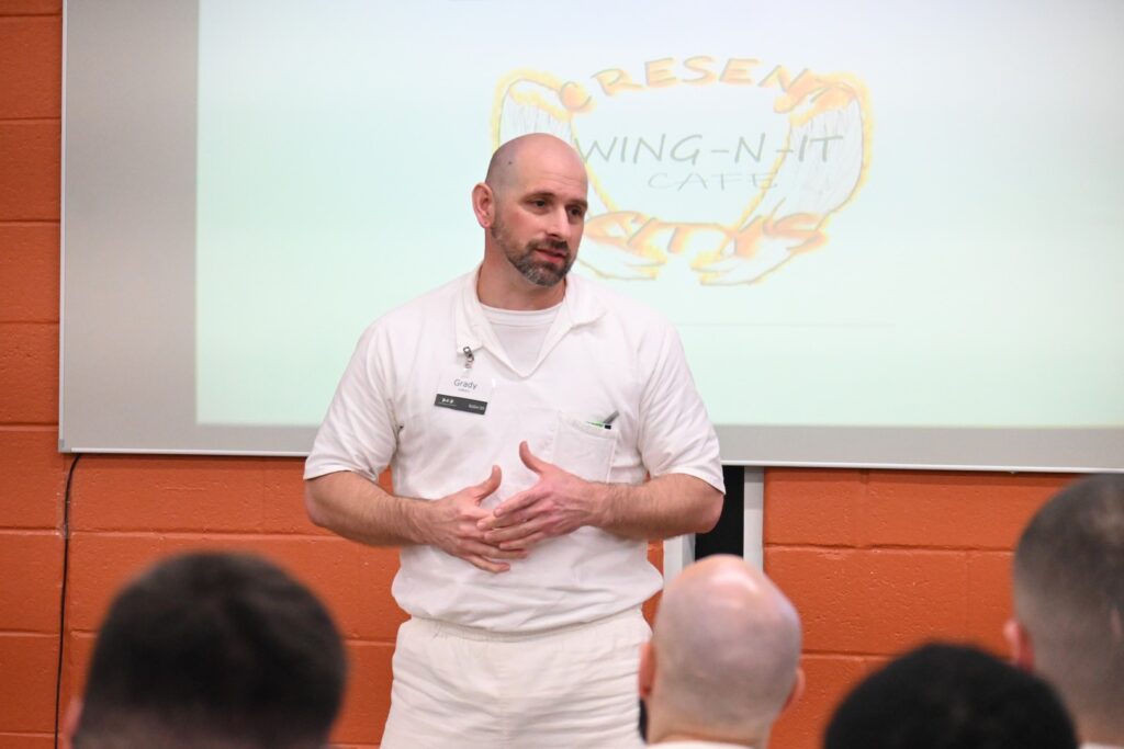 PEP participant Grady pitches his Crescent City Wings business plan during a Prison Entrepreneurship Program presentation session
