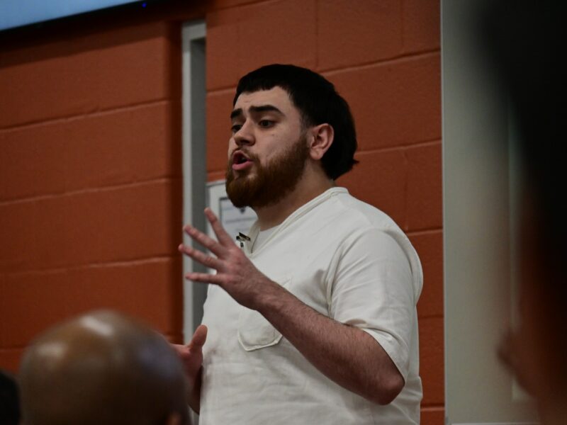 Participant in the Prison Entrepreneurship Program speaks during a Leadership Academy session