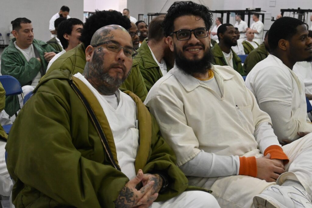 PEP participants seated and engaged during a Prison Entrepreneurship Program event inside a correctional facility