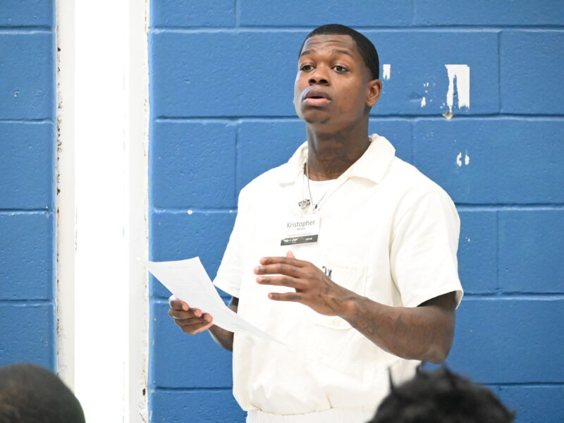 PEP participant Kristopher delivering a leadership presentation during the Prison Entrepreneurship Program, showcasing growth and public speaking skills