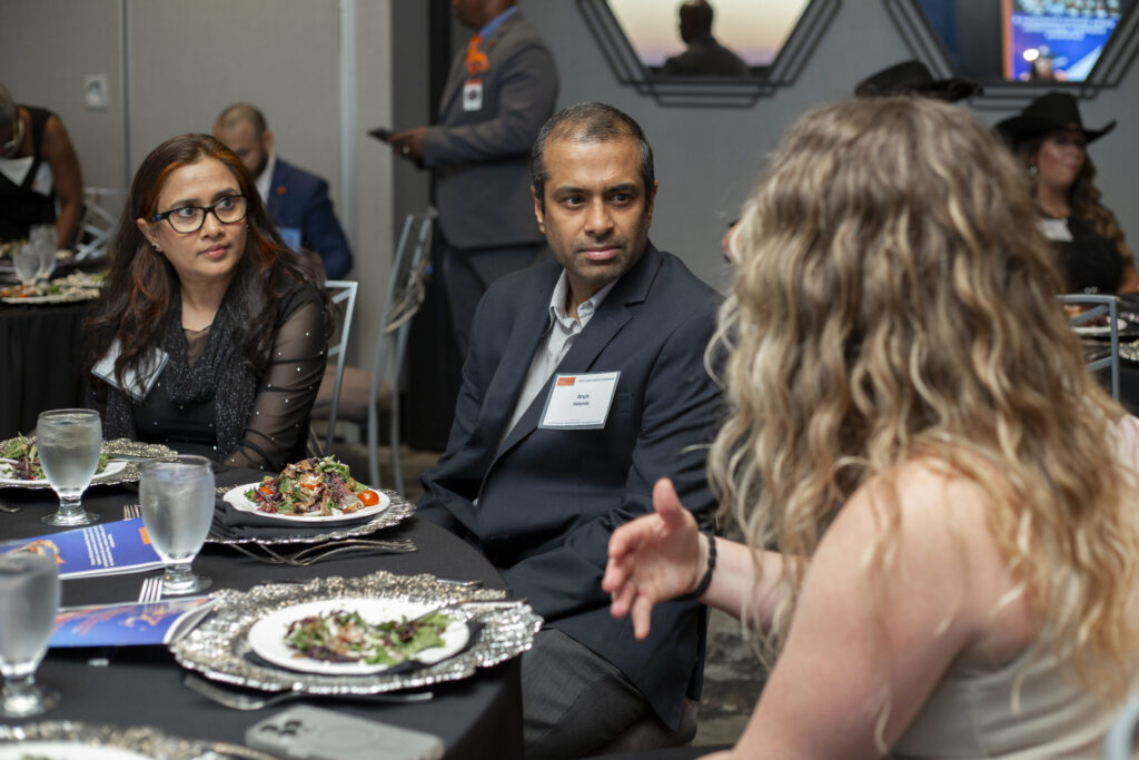 PEP supporters engage in thoughtful conversation over dinner during a Prison Entrepreneurship Program gala event