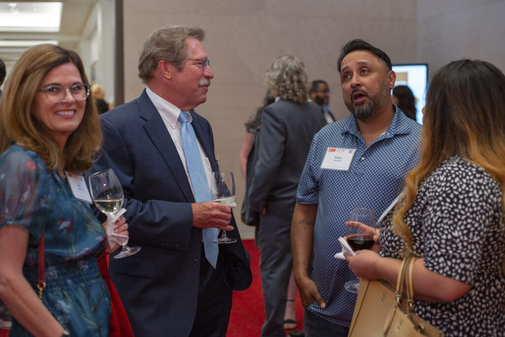 PEP graduates and supporters networking during a Prison Entrepreneurship Program event, building community and connection after incarceration