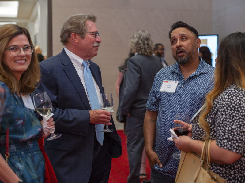 PEP graduates and supporters networking during a Prison Entrepreneurship Program event, building community and connection after incarceration