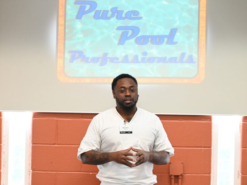 Prison Entrepreneurship Program participant presenting a business plan for Pure Pool Professionals during the Business Plan Competition