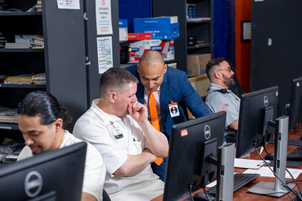 Prison Entrepreneurship Program participant receives one on one mentorship from a business leader, building job readiness, professional skills, and pathways to successful reentry