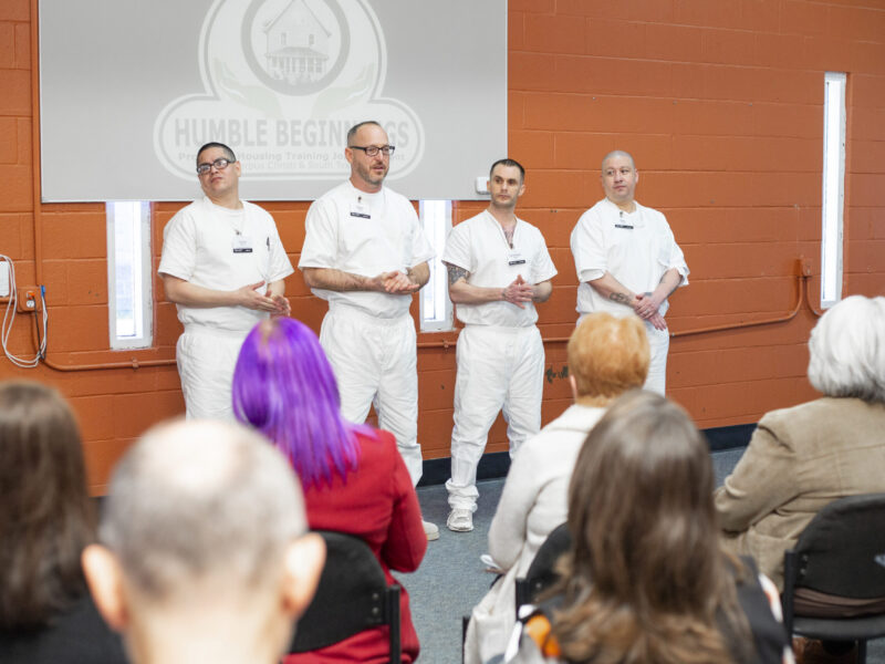 Participants in the Prison Entrepreneurship Program Business Plan Competition present their ventures to an audience, demonstrating public speaking, business development, and readiness for reentry through entrepreneurship