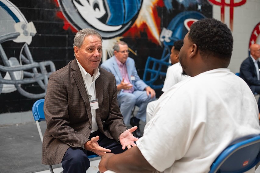 Volunteer mentoring a participant